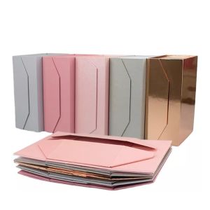 China Custom Logo Wedding Dress Rigid Magnetic Folding Cardboard Packaging Paper Gift Box With Ribbon Closure on sale