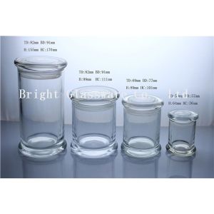 a series of different size glass jars for candles in stock
