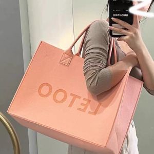 China Cosmetic Bag Multi-Pocket Handbag Cartoon Felt Bag With Logo Fashionable Splicing Colors Accept Custom Logo Gift Tote Bag Felt Clothes Shopping Korean Fashion Bags on sale