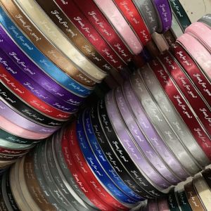 China Spot flower packaging, ribbon, silk tape, polyester tape, printed English gift box packaging, bouquet wrapping material, tape on sale