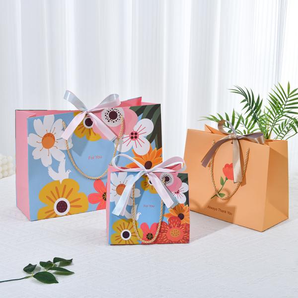Quality ​​Premium Floral Gift Bag With Gold Twine Handles Chic Bow Vibrant Blue Multicolor Bloom Design wholesale