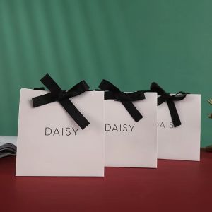 Embossing Ribbon Handle Cosmetic Paper Bags White Paper Carrier Bags