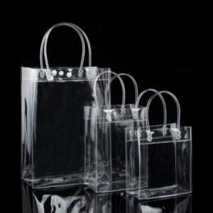 China 13x7x15cm Garment Plastic Packaging Bags PVC Transparent Tote Bag With Handle Button on sale