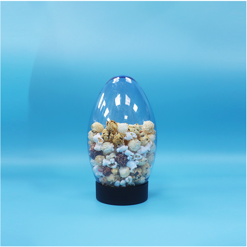 China Unique Egg-Shaped Plastic Candy Popcorn Pistachio Nut Candy Jar Upside Down Flat Cap on sale