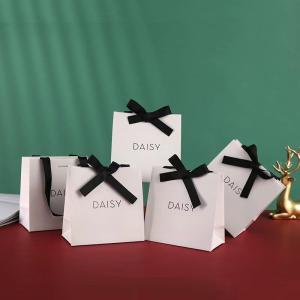 Embossing Ribbon Handle Cosmetic Paper Bags White Paper Carrier Bags