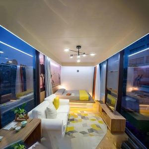 Installation of Apple Cabin House with Metal Carved Panel Exterior Wall and