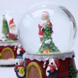 China Christmas music resin christmas snowman snow globe water globe snow ball on sale