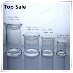 a series of different size glass jars for candles in stock