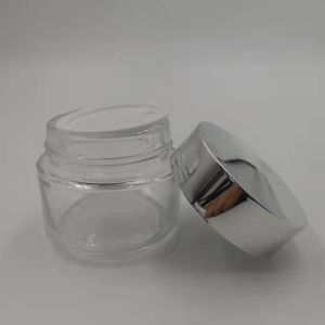 MSDS Clear 100g Glass Cream Jar With Shiny Silver Cap White Lid Mask Mud