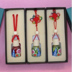 5ml car hanging perfume bottle with polymer clay designs.
