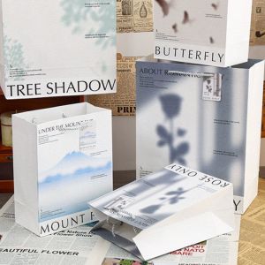 China Custom Color White Heavy Capacity Size Luxury Gift Blank Package Handle Paper Bag Tote Kraft Paper Shopping Bag on sale