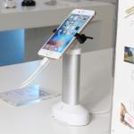 Retail security display cell phone holder with alarm sensor and charging cord