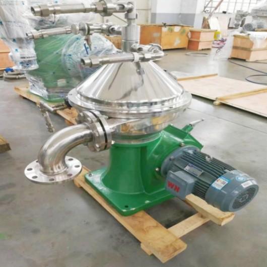 Continuous High Speed Disk Centrifuge For Separating Solids And Liquids In
