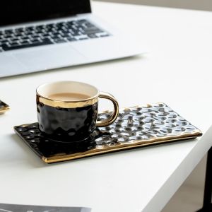 China Elegant Black Ceramic Mugs With Gold Accents Wavy Textures For Coffee Tea Pastry Pairings Modern Minimalist Design on sale