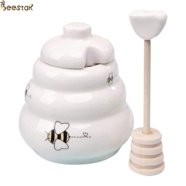 Quality Wholesale White Empty Honey Jar Ceramic Honey Pot with wooden dipper for honey storage wholesale