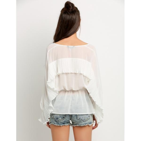 Model wearing the blouse in casual setting