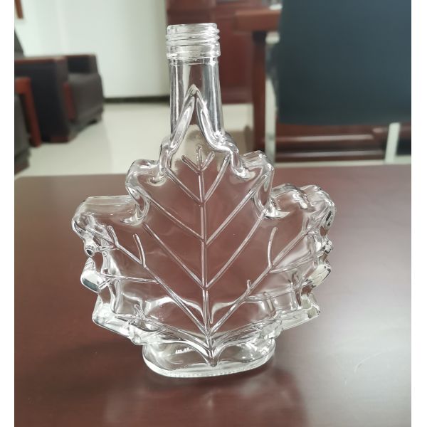 Quality High Borosilicate 25cl Leaf Shape Spirit Glass Bottle With Screw Cap wholesale