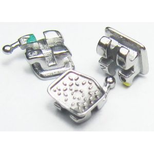 China MIM One Pieces Metal Brackets Dental Orthodontic Instruments With Serated Base on sale