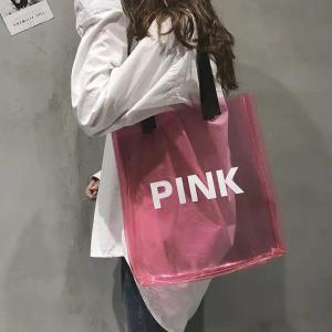 China Custom woman clear pink pvc laser transparent shiny handbags lady shoulder beach summer pvc tote bags with custom printe on sale