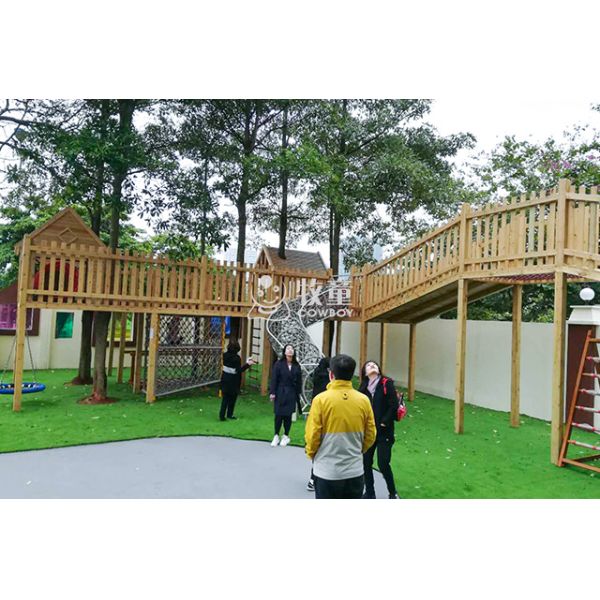 Kindergarten wooden tree house outdoor playground equipment with climbing net