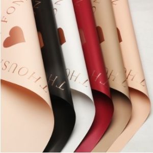 China DIY Handmade Gifts Mutiple Color Gold Stamping True Heart Flower Wrapping Paper Waterproof Plastic Paper For Flower Shop on sale