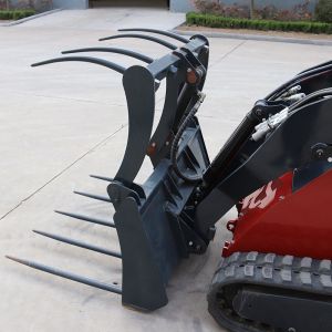 Mini skid steer loader wiht Grass grapple