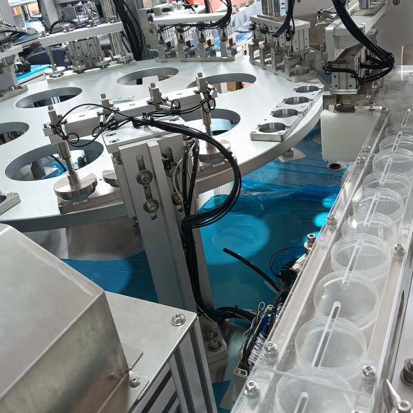 Quality Automated urine cup assembly machine, compatible with feeding elevators and connectable to injection moulding machines, enhances product assembly efficiency and reduces labour requirements. wholesale
