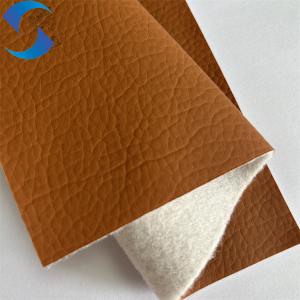 Cheap 100% Polyester Non Woven Backing Artificial Leather Fabric Embossed Pattern for sale